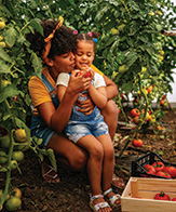 mom and daughter in a garden